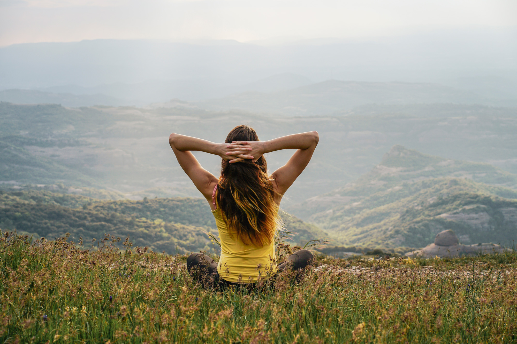relaxed woman on a mountain